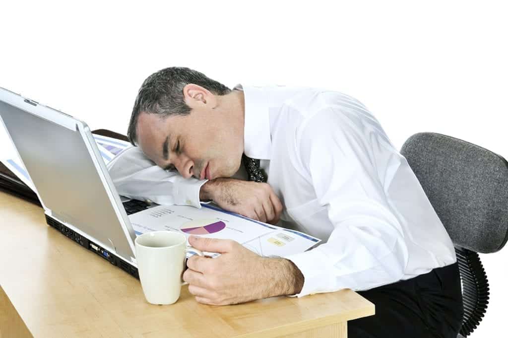 Man asleep at his computer