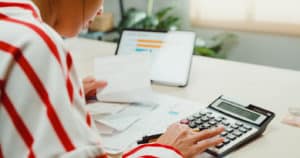 Using CAAS and calculator for business finances.